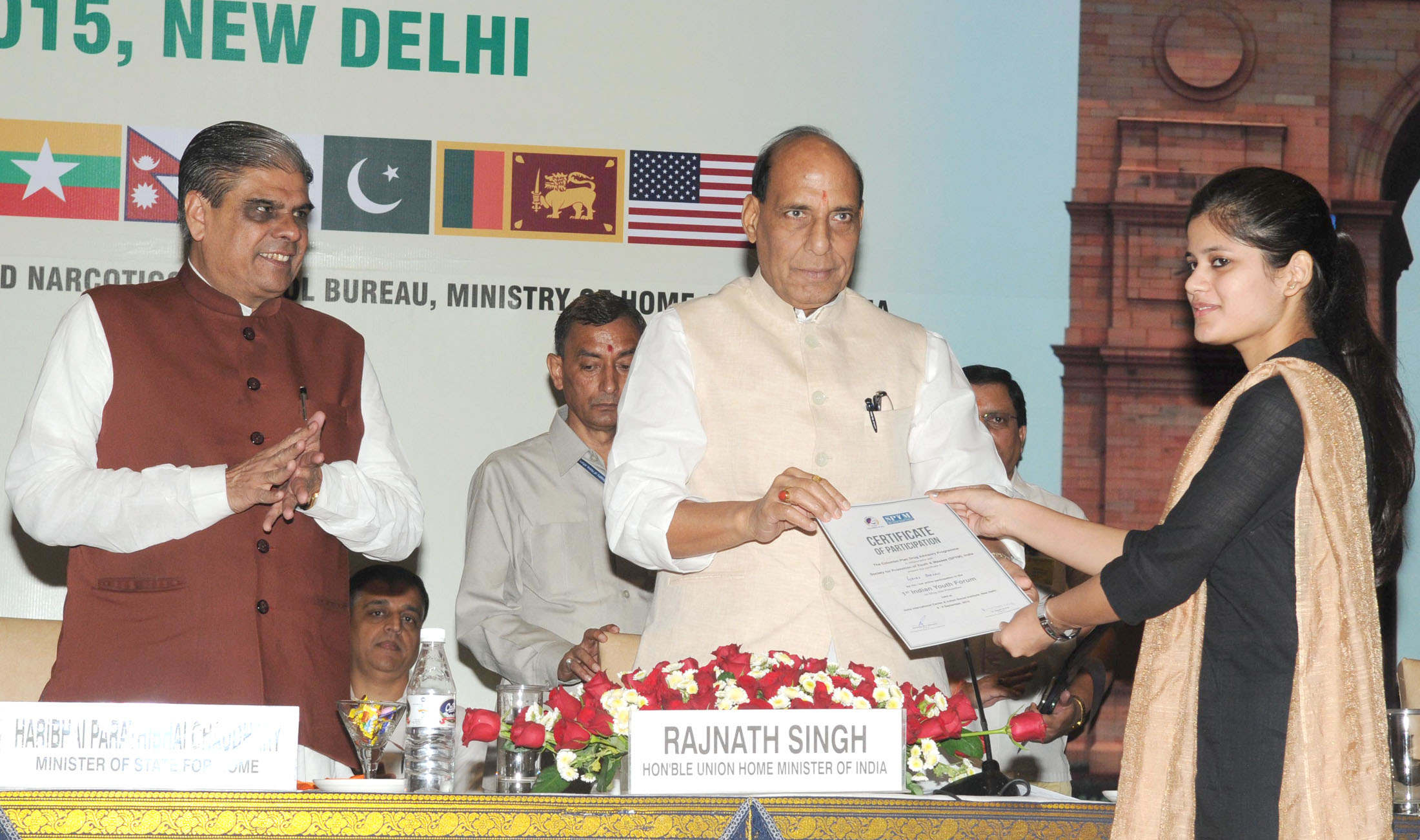 The Union Home Minister, Shri Rajnath Singh distributing the certificate to a youth representative at the inauguration of a three-day workshop on Sub-Regional Drug Focal Point Meeting and DDR Expert Group Consultation, South Asia under Colombo Plan Drug Advisory Programme, in New Delhi on September 09, 2015.   	The Minister of State for Home Affairs, Shri Haribhai Parthibhai Chaudhary is also seen.