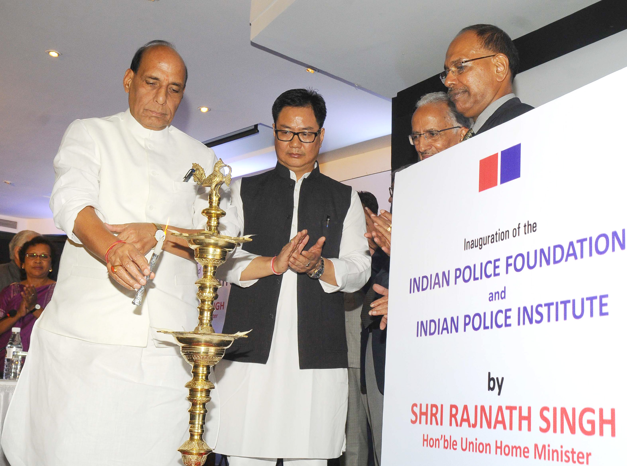 The Union Home Minister, Shri Rajnath Singh lighting the lamp to inaugurate the Indian Police Foundation and the Indian Police Institute, in New Delhi on October 21, 2015. 	The Minister of State for Home Affairs, Shri Kiren Rijiju and other dignitaries are also seen.