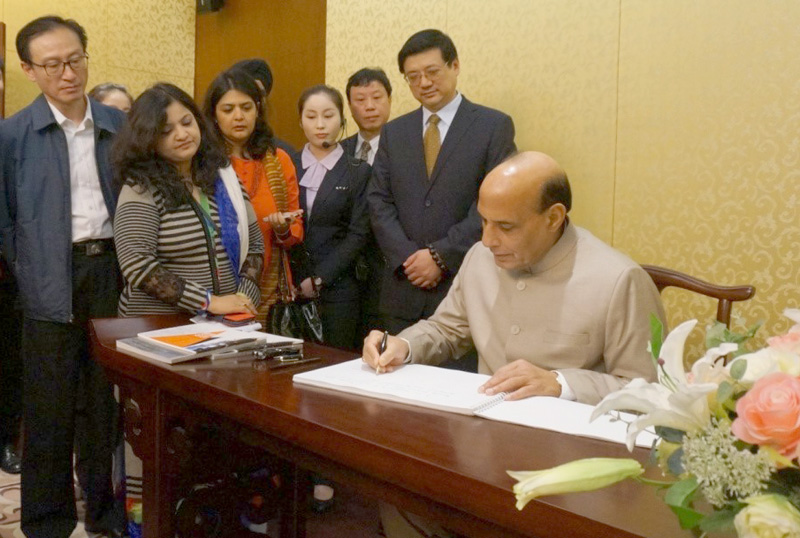 The Union Home Minister, Shri Rajnath Singh signing the visitors book during his visit  to the Shanghai Urban Planning Exhibition Centre, in China on November 22, 2015.