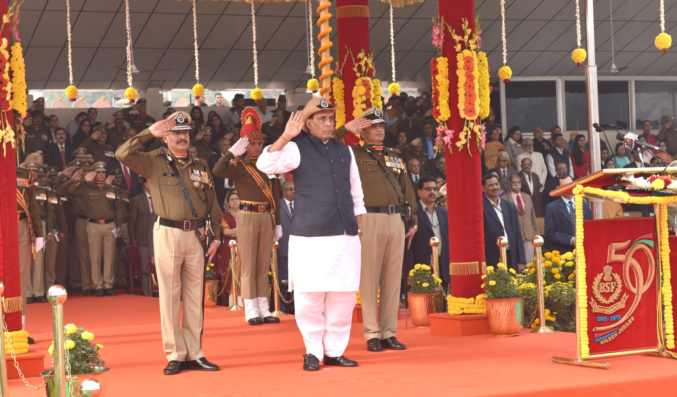 The Union Home Minister, Shri Rajnath Singh taking the salute of the BSF Golden Jubilee Parade, in New Delhi on December 01, 2015.  	The DG, BSF, Shri D.K. Pathak is also seen.