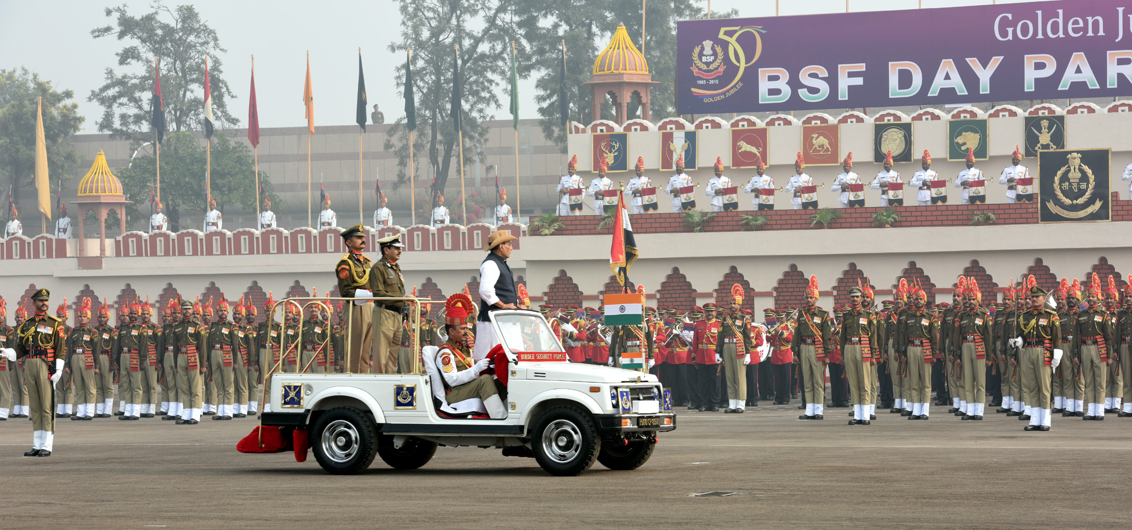 The Union Home Minister, Shri Rajnath Singh reviewing the BSF Golden Jubilee Parade, in New Delhi on December 01, 2015.  	The DG, BSF, Shri D.K. Pathak is also seen.