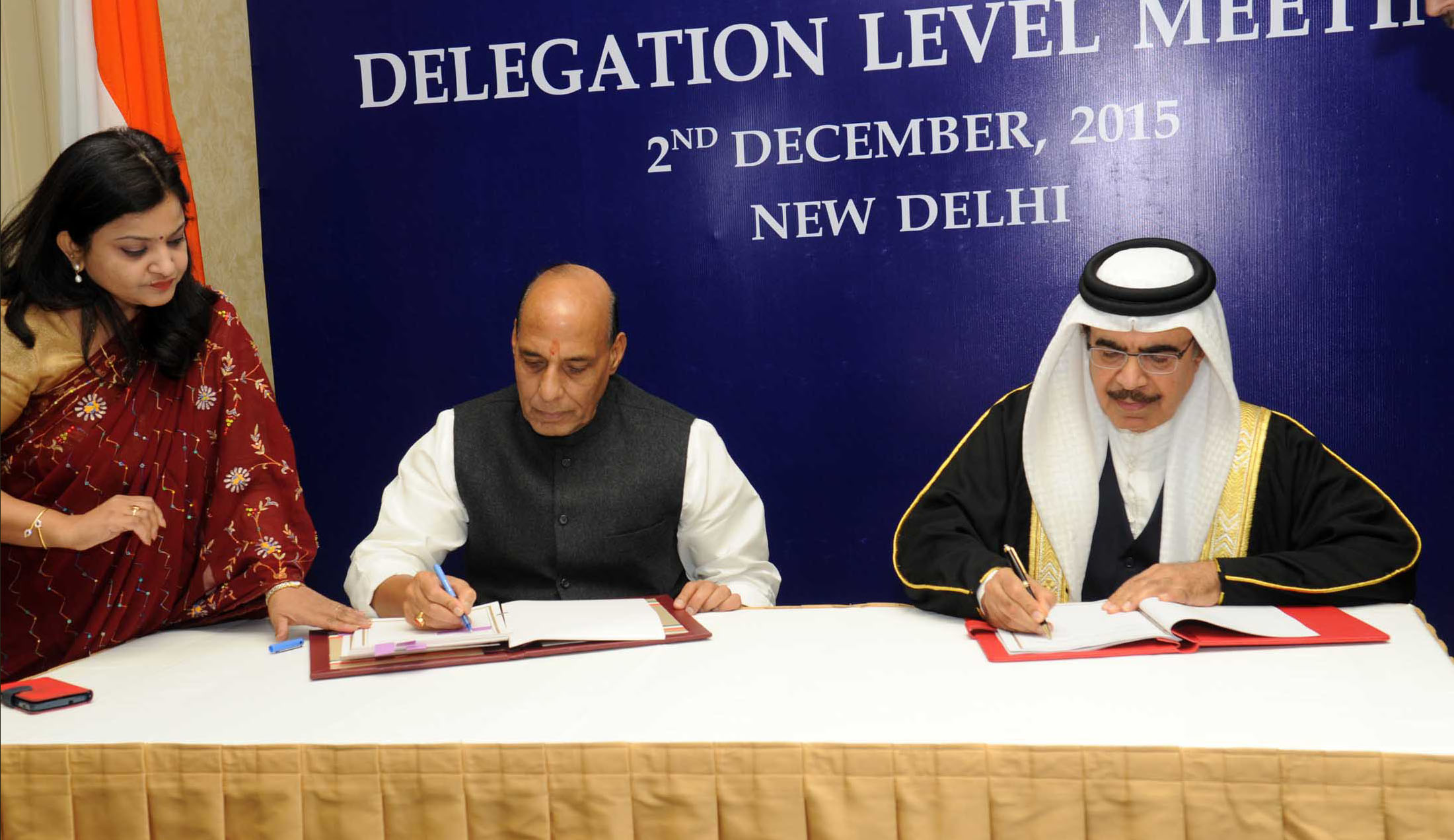 The Union Minister of Home Affairs Shri Rajnath Singh and the Minister of Interior of the Kingdom of Bahrain, Lt. General Shaikh Rashid bin Abdulla al Khalifa signing an Agreement on bilateral cooperation between India and Bahrain, in New Delhi on December 02, 2015.