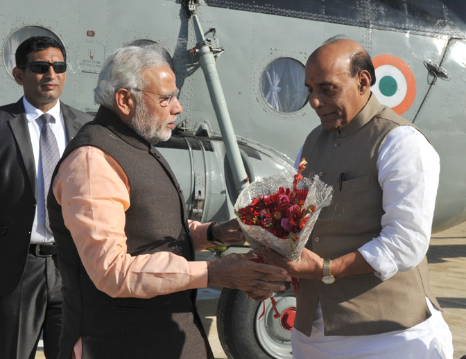 The Prime Minister, Shri Narendra Modi being received by the Union Home Minister, Shri Rajnath Singh, on his arrival at Dhordo, in Gujarat on December 18, 2015.