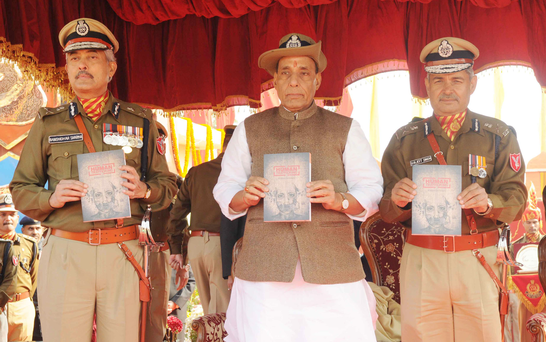 The Union Home Minister, Shri Rajnath Singh releasing a book titled Human Trafficking at the 52nd anniversary parade of Sashastra Seema Bal, in New Delhi on December 24, 2015.