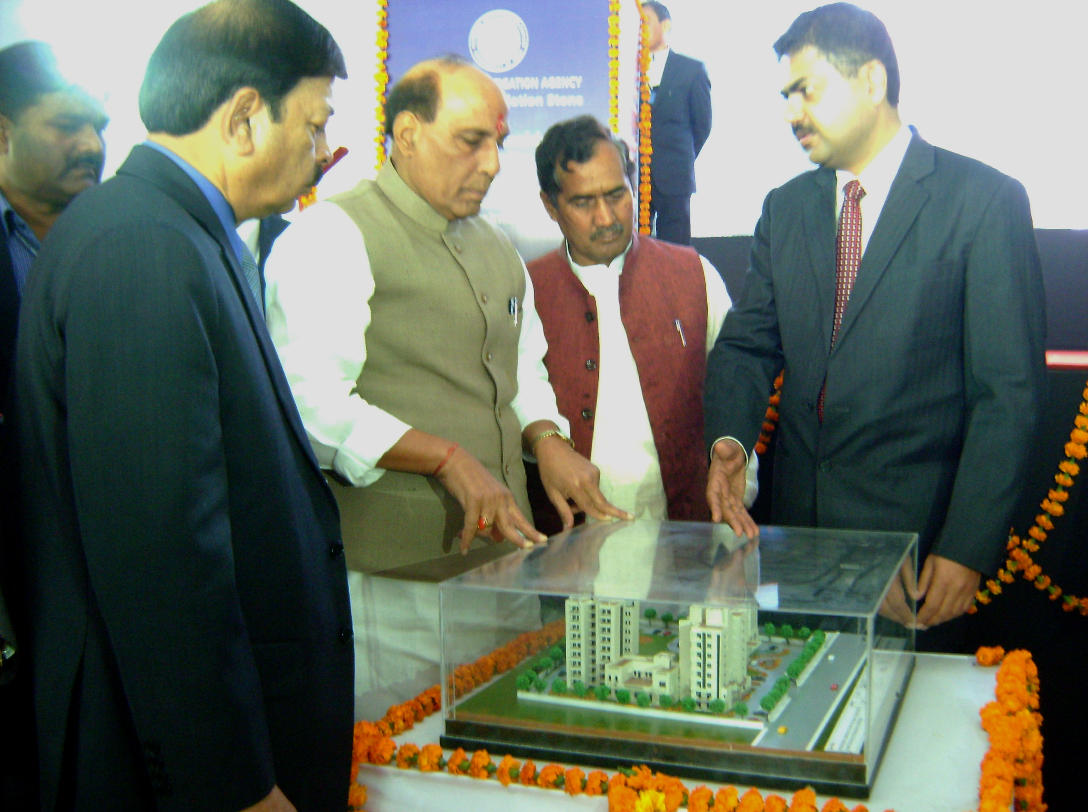 The Union Home Minister, Shri Rajnath Singh inspecting the model of the proposed building of Office-cum-Residential Complex of the National Investigation Agency (NIA), in Lucknow on December 28, 2015.