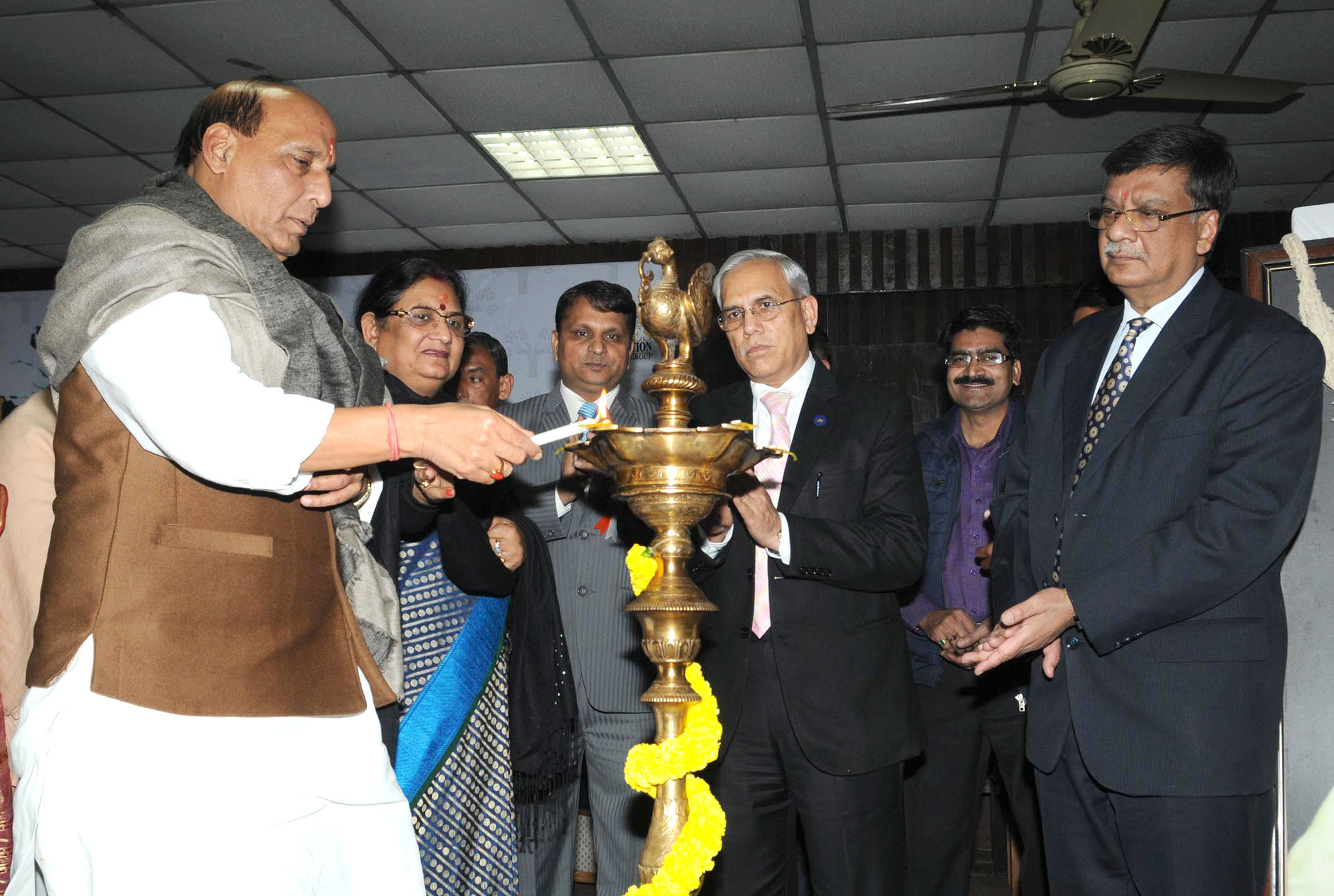 The Union Home Minister, Shri Rajnath Singh lighting the lamp to launch the project Empowering elderly through young generation, in New Delhi on January 17, 2016.
