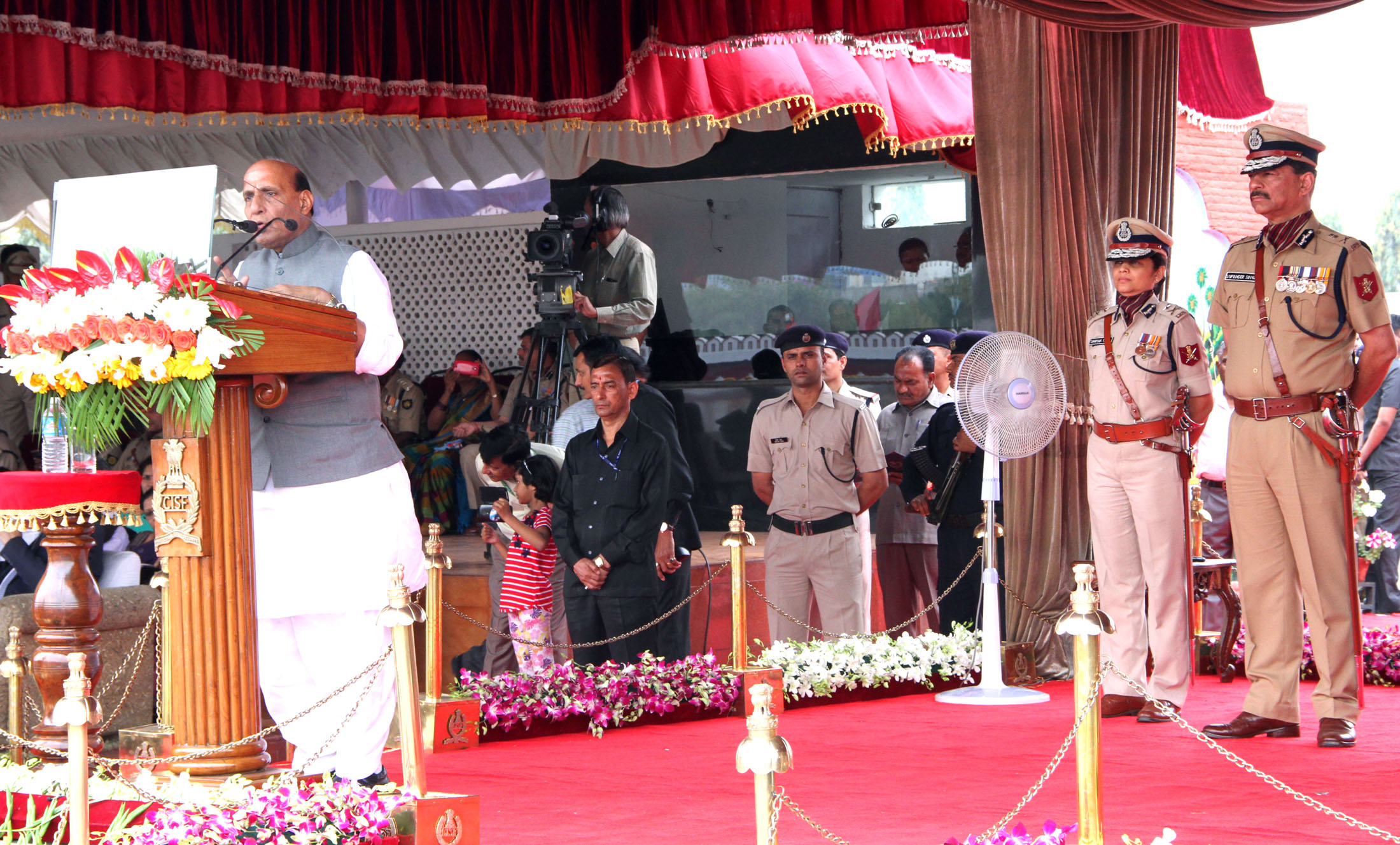 The Union Home Minister, Shri Rajnath Singh addressing at the 47th Raising Day function of the CISF, in Ghaziabad on Friday, March 11, 2016.  The Director General, CISF, Shri Surender Singh is also seen.