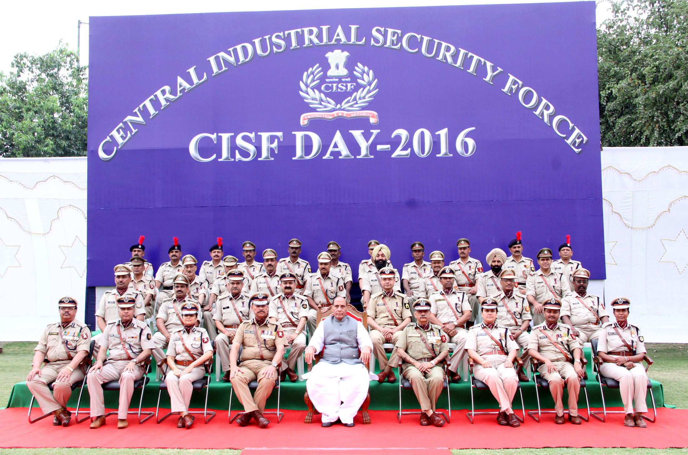 The Union Home Minister, Shri Rajnath Singh in a group photograph at the 47th Raising Day function of the CISF, in Ghaziabad on Friday, March 11, 2016.  The Director General, CISF, Shri Surender Singh is also seen.