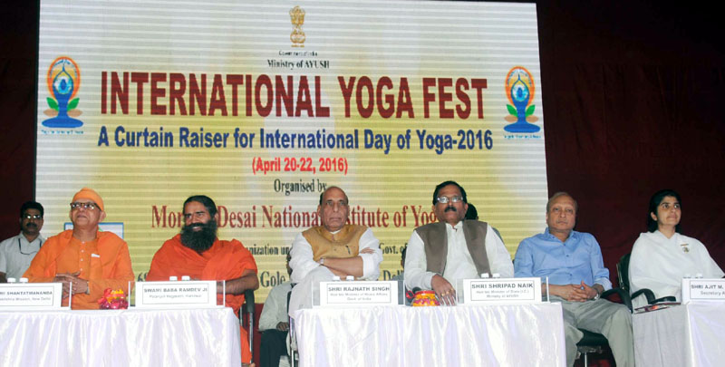 The Union Home Minister, Shri Rajnath Singh and the Minister of State for AYUSH (Independent Charge) and Health & Family Welfare, Shri Shripad Yesso Naik, at the valedictory function of the International Yoga Fest, organised by the Ministry of AYUSH, in New Delhi on April 22, 2016. 	Swami Baba Ramdev and other dignitaries are also seen.