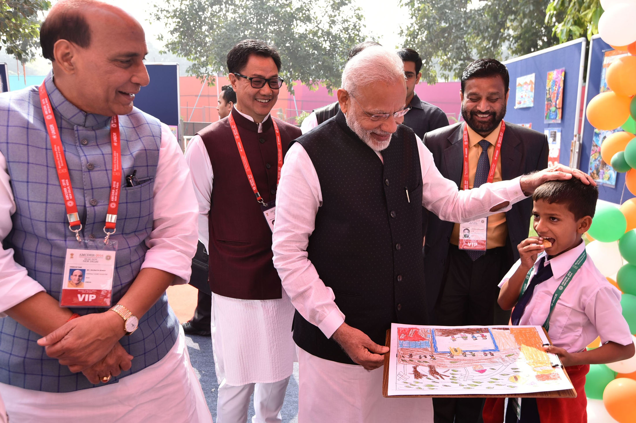 The Prime Minister, Shri Narendra Modi and Home Minister Shri Rajnath Singh with the participants of Painting Contest at the Asian Ministerial Conference on Disaster Risk Reduction, in New Delhi on November 03, 2016. 	The Minister of State for Home Affairs, Shri Kiren Rijiju also seen.
