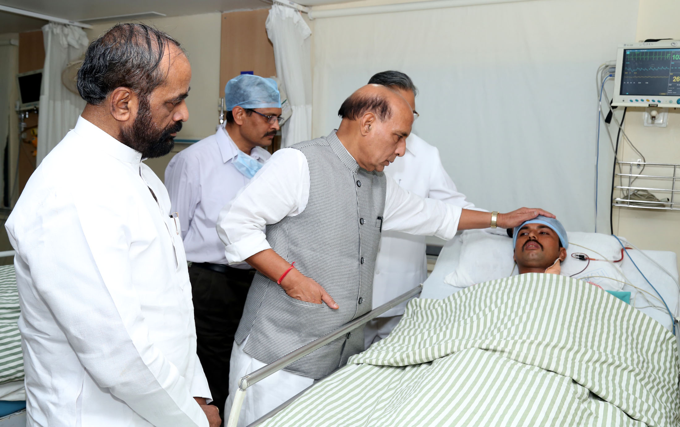 The Union Home Minister, Shri Rajnath Singh enquiring about the health of injured CRPF personnel at the Ramkrishna Care Hospital, in Raipur, Chhattisgarh on April 25, 2017. The Minister of State for Home Affairs, Shri Hansraj Gangaram Ahir is also seen.