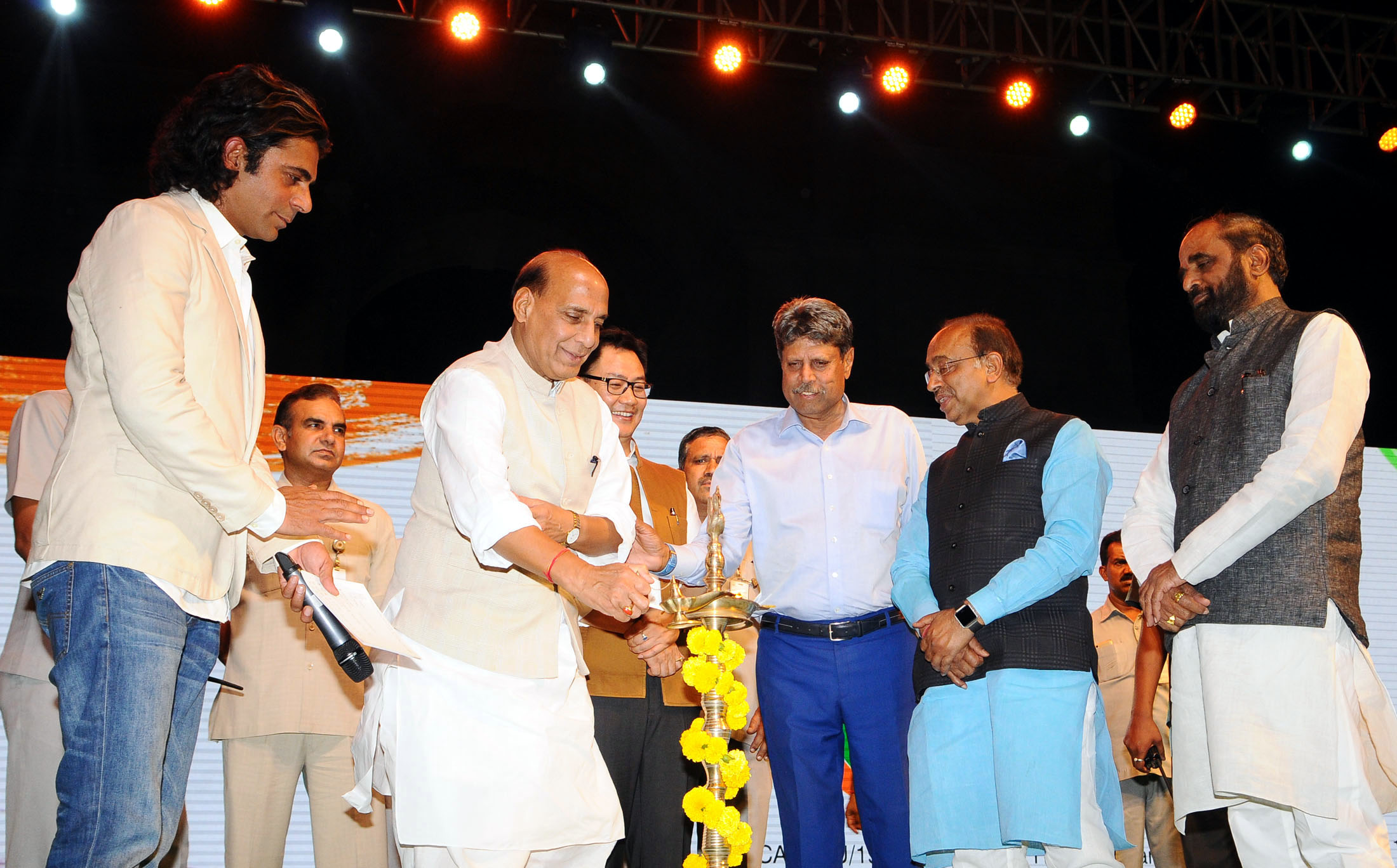 The Union Home Minister, Shri Rajnath Singh lighting the lamp to inaugurate the Curtain Raiser event 'Oorja', a U-19 Football Talent Hunt Tournament , organised by the Central Armed Police Forces and Central Police Organisation, in New Delhi on April 22, 2017.  The Minister of State for Youth Affairs and Sports (I/C), Water Resources, River Development and Ganga Rejuvenation, Shri Vijay Goel, the Minister of State for Home Affairs, Shri Hansraj Gangaram Ahir and Shri Kiren Rijiju and other dignitaries are also seen.