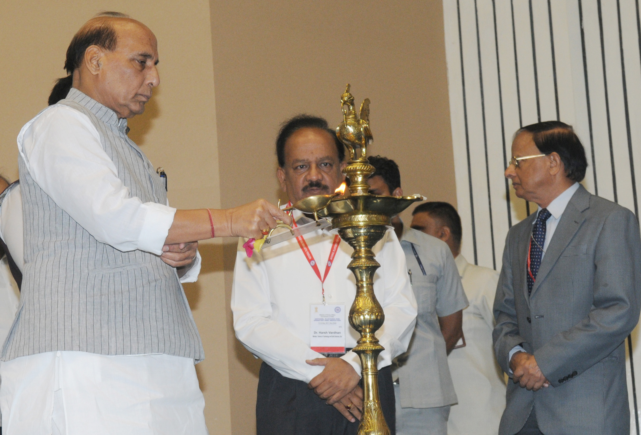The Union Home Minister, Shri Rajnath Singh lighting the lamp to inaugurate the second meeting of the National Platform for Disaster Risk Reduction (NPDRR), in New Delhi on May 15, 2017. 	The Union Minister for Science & Technology and Earth Sciences, Dr. Harsh Vardhan and the Additional Principal Secretary to the Prime Minister, Dr. P.K. Mishra are also seen.