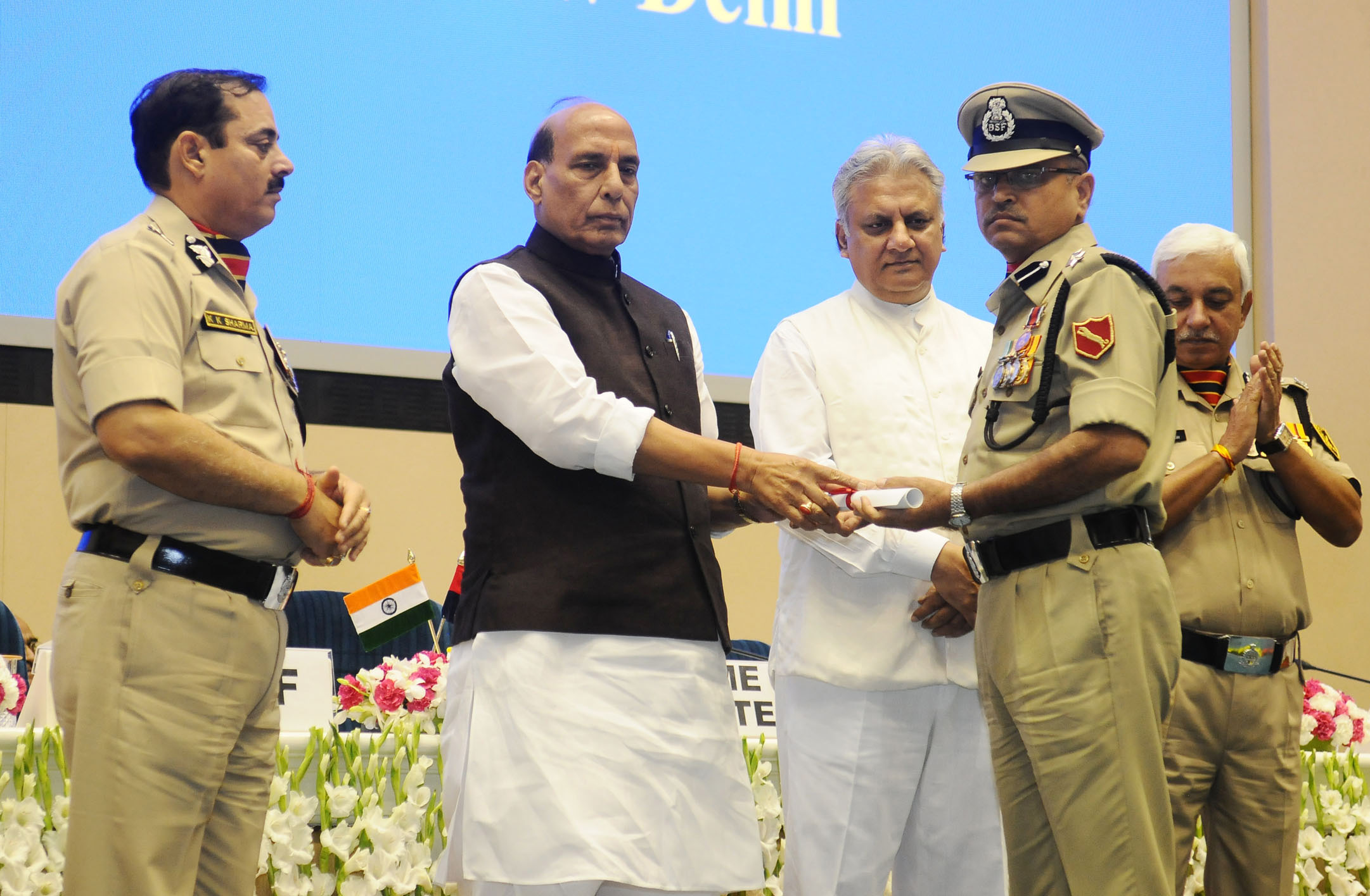 The Union Home Minister, Shri Rajnath Singh presenting the awards, at the Investiture Ceremony of Border Security Force (BSF), in New Delhi on May 22, 2018. The DG, BSF, Shri K.K. Sharma and the Director IB, Shri Rajiv Jain are also seen.